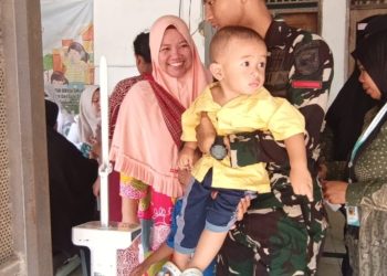 Personel Satgas TMMD Ke-129 Kodim 0418/Palembang Kawal Pelayanan Posyandu, Pastikan Ibu dan Balita Terlayani dengan Baik